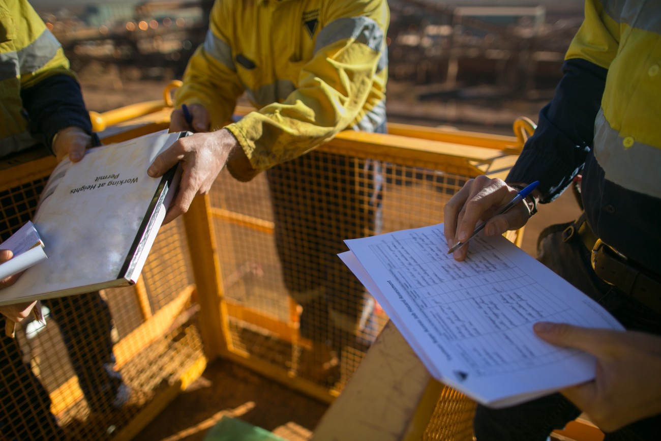 Close up image of builders and their building documents