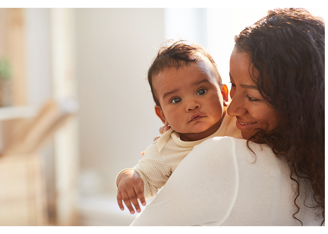 mother holding baby