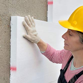 photo of worker installing rigid insulation